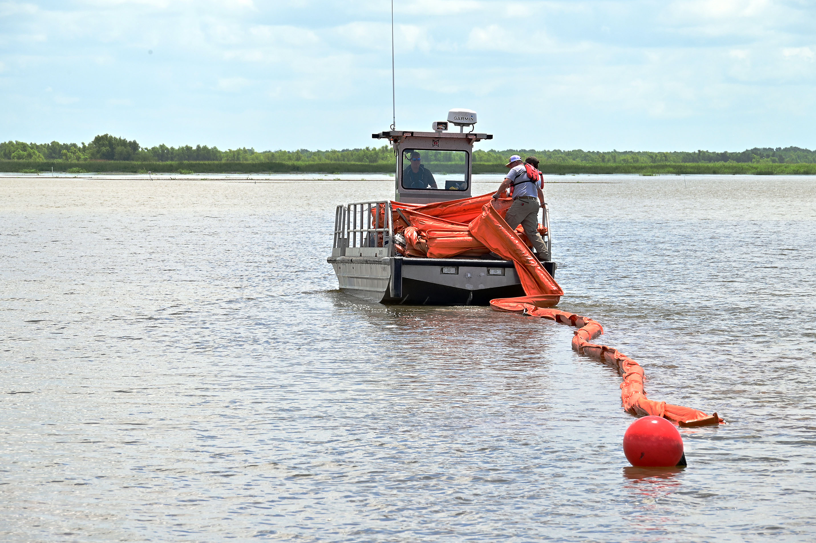 A boat with approximately 600 feet of containment boom is deployed as part of a government initiated unannounced exercise conducted by the Bureau of Safety and Environmental Enforcement Wednesday, June 1, 2022, off the Louisiana coast. A GIUE is a preparedness verification function BSEE employs to witness and evaluate, on a no-notice basis, a plan holder’s capabilities to respond to a hypothetical oil spill.