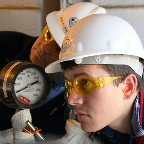 Intern Grant Cummings receives training from BSEE Inspector, Michael Jordan, during an onsite inspection at Northstar Island in the Beaufort Sea on Aug. 8.