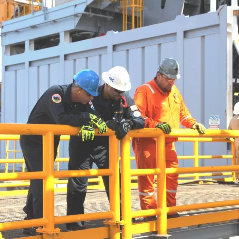 BSEE inspector points out to Director Angelle the components of the redundant subsea blowout preventer ready on board the Diamond Offshore Ocean BlackLion.