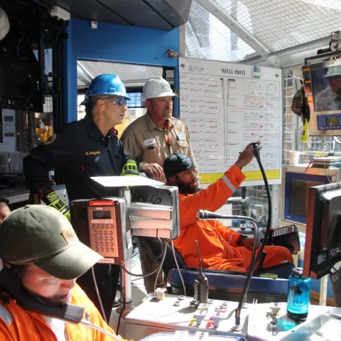 BSEE Director Angelle observing in the drill shack on board the Diamond Offshore BlackLion drillship as the driller explaining the testing of safety devices.