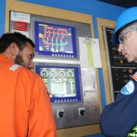 BSEE Director Angelle listens to Diamond Offshore drill crew member describe details  of well control drill. This drill simulated circulating out a kick.