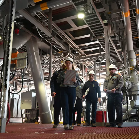 Emily Empert, a Bureau of Safety and Environmental Enforcement (BSEE) production field engineer from the Houma, La. District, inspects the area surrounding the production header aboard Murphy Oil’s King’s Quay Feb. 2, 2022. BSEE is conducting an offshore pre-production inspection of the floating production system (FPS), which is moored approximately 100 nautical miles off the coast of Houma, LA in Block 433 of Green Canyon.