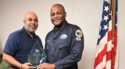 BSEE Director Kevin Sligh, left, presents Jason Bowens with the BSEE Inspector of the Year award for FY 2022, Nov. 11, 2022. Bowens is a member of the New Orleans District Production Operations Inspection Unit.